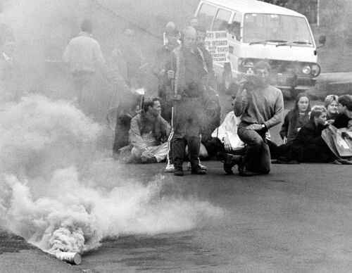 Anti-tour protesters with smoke bombs