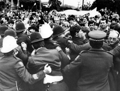 Protesters clash with police during an anti-tour demonstration