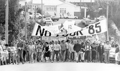 Anti-tour protesters march in the streets