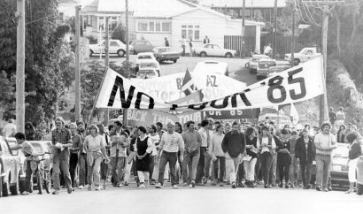 Anti-tour protesters march in the streets