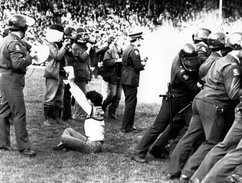 Protesters clash with police during an anti-tour demonstration