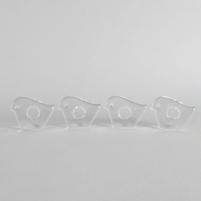 A Set of Four Pukeberg Glass Napkin Holders