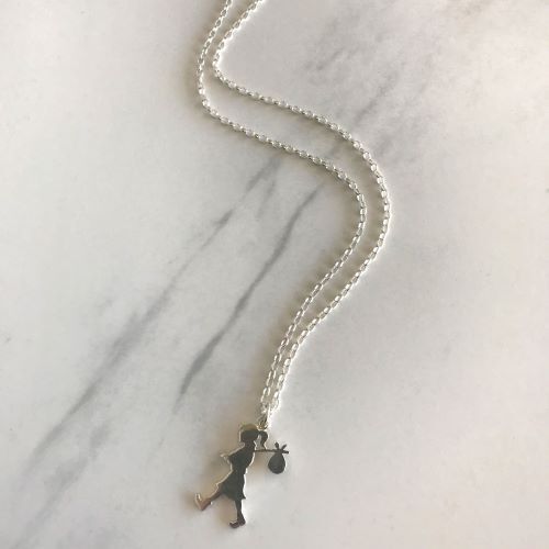 A Large Sterling Silver Runaway Girl Pendant by Karen Walker
