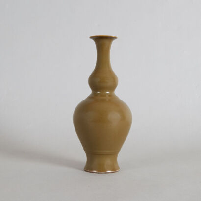 A Chinese Qing Dynasty Teadust-glazed Double-gourd Vase (Da Qing Qianlong Nian Zhi Mark)