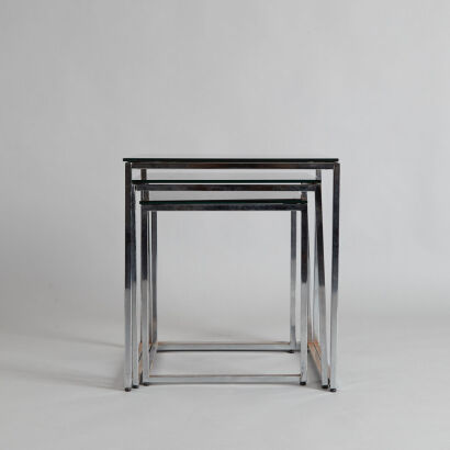 A Set of Glass and Chrome Nesting Tables