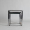 A Set of Glass and Chrome Nesting Tables