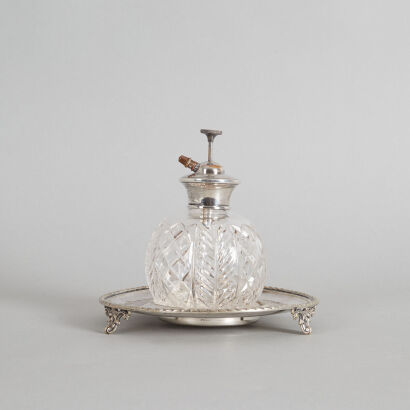 A Perfume Bottle on a Silver Stand