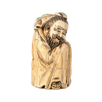 A Chinese Ivory Carving Depicting An Immortal