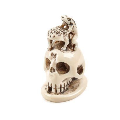 A Late-Meiji Period Ivory Frogs on Skull Okimono/Netsuke