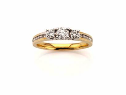 A Yellow and White Gold Three Stone Diamond Ring