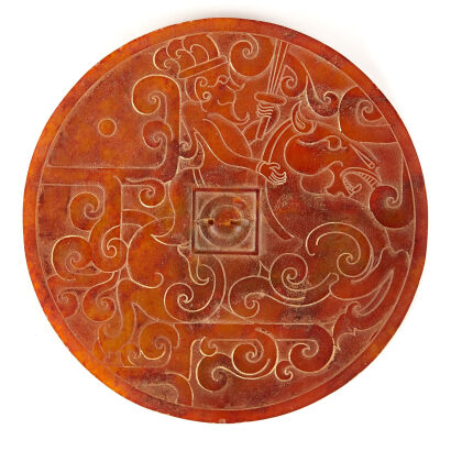 A Chinese Ornamented Brown Jade Disc