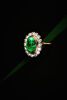 An Important 6.04ct Emerald and Diamond Cluster Ring