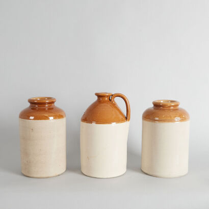 A Set of Three Stoneware Demijohns