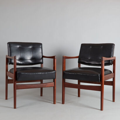 A Pair of Black Vinyl Covered Executive Chairs