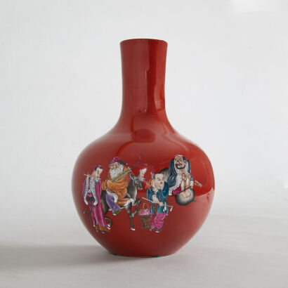 A Chinese Red-glazed 'Eight Immortals' Vase (Da Qing Qianlong Nian Zhi Mark)