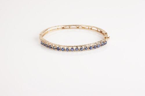 A 14ct Gold Sapphire Bangle