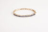 A 14ct Gold Sapphire Bangle