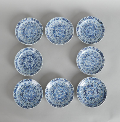 Eight 19th Century Chinese Blue and White 'Fish' Saucers (Kangxi Nian Zhi Mark)