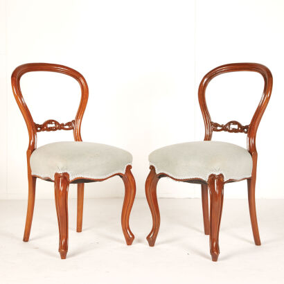 A Set of Eight Victorian Style Balloon Back Dining Chairs and Two Carvers