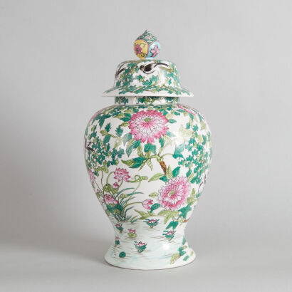 A Chinese Famille Rose Temple Jar and Wood Stand (Da Qing Qianlong Nian Zhi Mark)