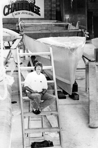 PHOTOGRAPHER UNKNOWN Peter Blake beside the unfinished hull of his racing trimaran Steinlager One