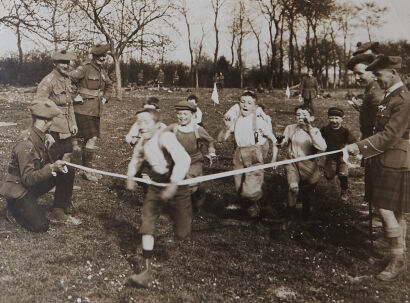 PHOTOGRAPHER UNKNOWN French Children Racing on the Western Front, under the auspices of the Scottish Black Watch Regiment WW1