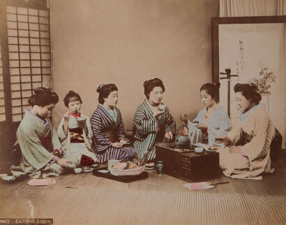 PHOTOGRAPHER UNKNOWN Group of Women Eating Sushi