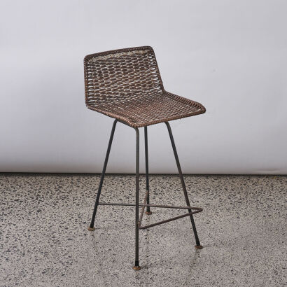 A Brown Rattan Lowback Bar Stool