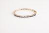 A 14ct Gold Sapphire Bangle