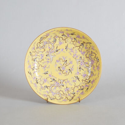 A Chinese Yellow-ground Famille Rose 'Magpie and Prunus' Dish (Tongzhi Nian Zhi Mark)