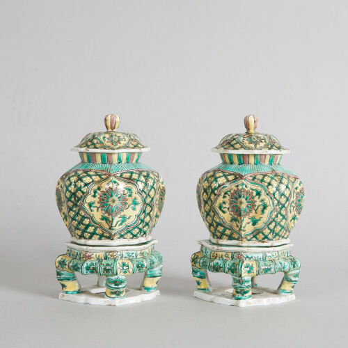 A Pair of Chinese Famille Verte Lidded Jars with bases