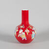 A Chinese Red-Ground Famille Rose Bottle Vase Decorated with Feature Scenes of Young Boys at Play (Da Qing Qianlong Nian Zhi Mark)