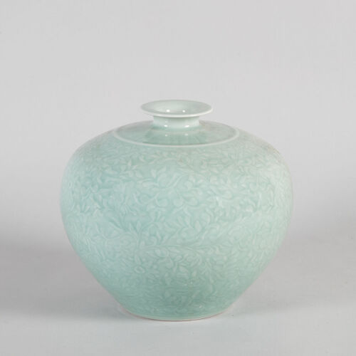 A Carved Chinese Celadon-Glazed 'Floral' Vase (Da Qing Qianlong Nian Zhi Mark)