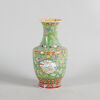 A Chinese Green-Ground Famille Rose 'Floral' Vase (Da Qing Qianlong Nian Zhi Mark)