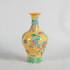 A Carved Chinese Yellow-Ground Famille Rose Vase (Da Qing Qianlong Nian Zhi Mark)