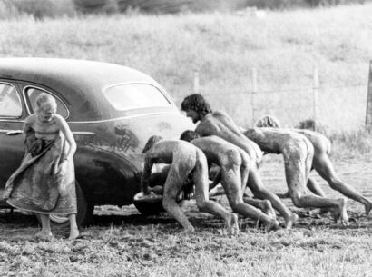 Pushing a car out of the mud at Sweetwaters Music Festival, Ngāruawāhia