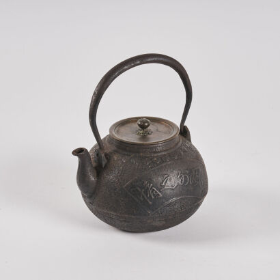 A Japanese Iron Teapot and Cover