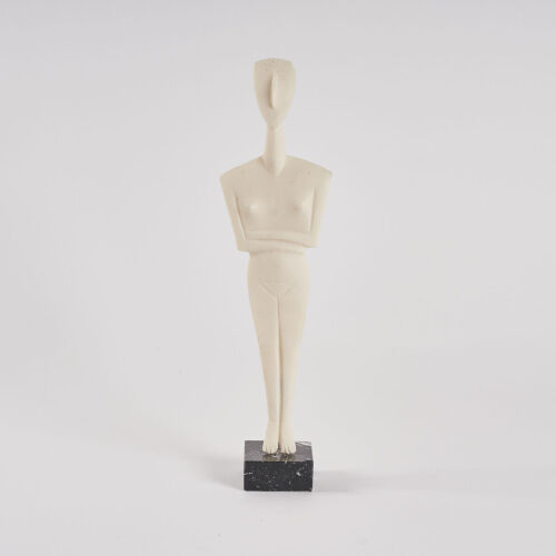 A Cycladic Female Figurine On a Marble Base