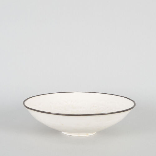 A Chinese White-Glazed Moulded 'Floral' Bowl