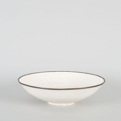 A Chinese White-Glazed Moulded 'Floral' Bowl