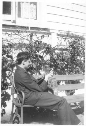 PHOTOGRAPHER UNKNOWN Lawrence Baigent with Cat