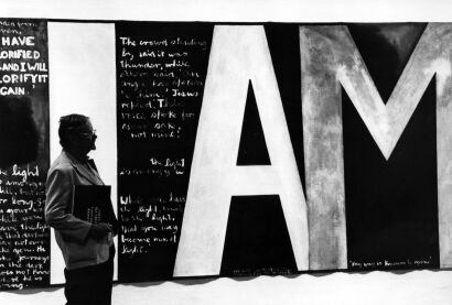 PHOTOGRAPHER UNKNOWN Toss Woollaston in front of Colin McCahon's painting "Victory over Death"