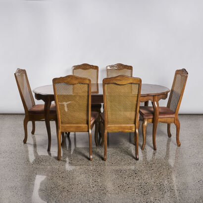 A Parquet Top Extendable Dining Table With Six Chairs with Cane Backs