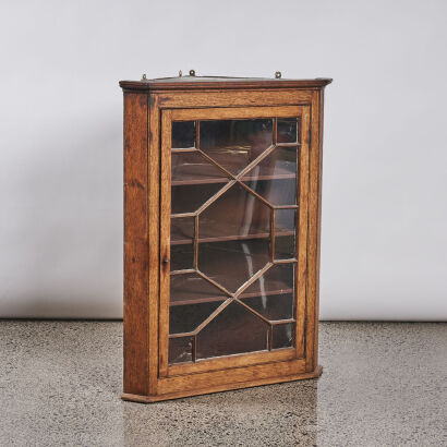 An Antique Oak Glazed Corner Cabinet