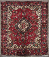 A Large Hand-Knotted Wool Pile Iranian Carpet