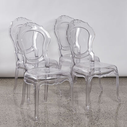 A Set Of Four Philippe Starck Style Ghost French Dining Chairs