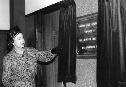 ANN SHELTON The Queen unveils a plaque to open Linton Camp gymnasium