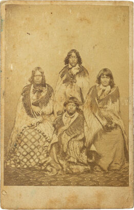 ATTRIBUTED TO SAMUEL CARNELL, NAPIER Four Māori women, seated in Victorian dress and korowai cloaks, from Poverty Bay