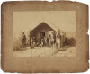 F. A. COXHEAD, DUNEDIN Ngāti Whakaue whare, Ohinemutu - Māori couple with 8 children in front of whare with garden
