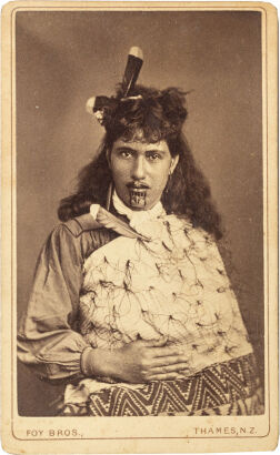 FOY BROS, THAMES Portrait of Māori woman in Victorian dress with korowai cloak pinned with a Huia feather